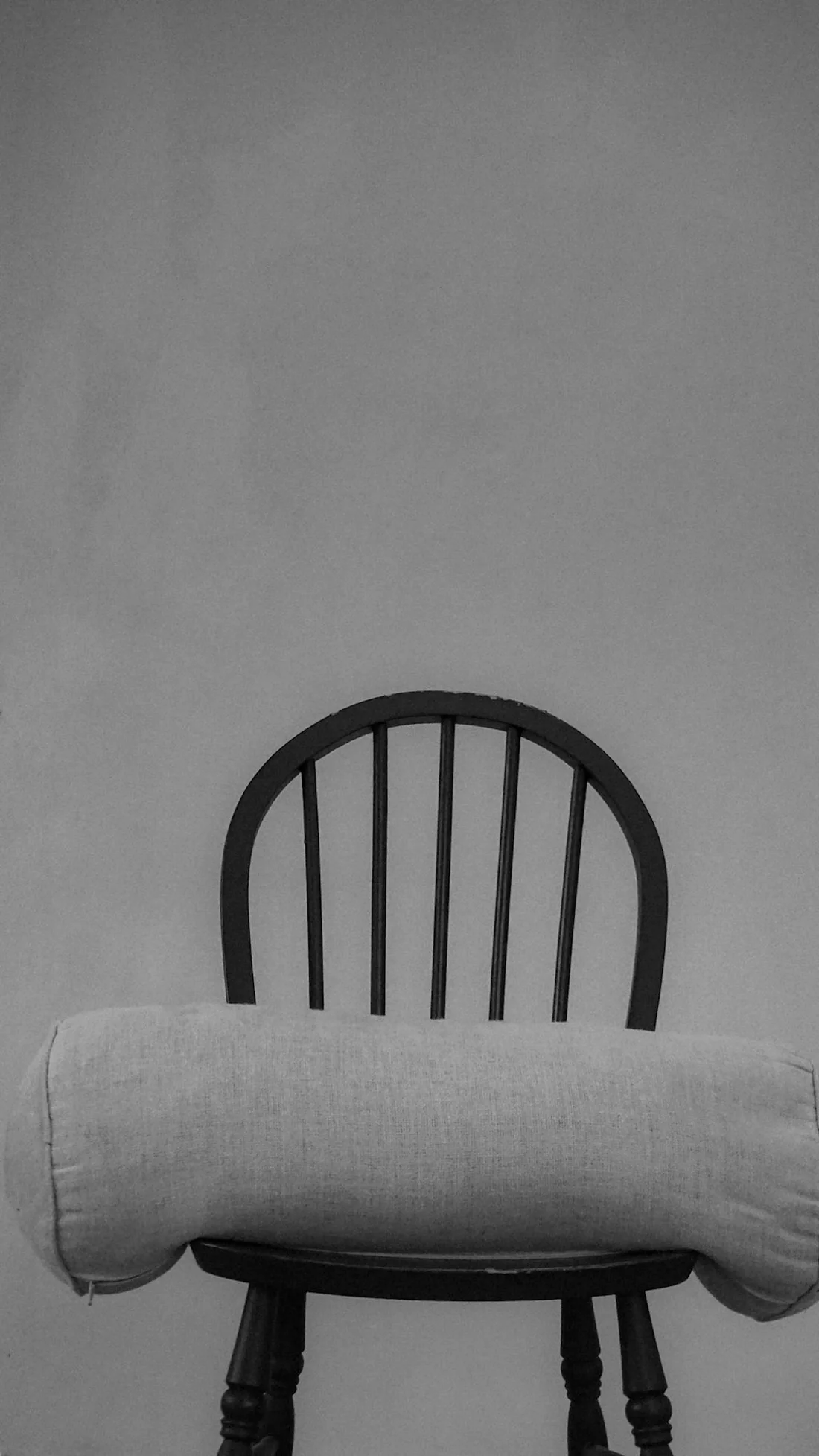 A bolster waiting on a chair at the end of a day